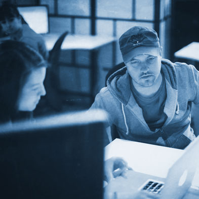 Guy and Lady in front of laptop darker